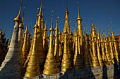 Inle Lake Myanmar. Indein, on the summit of a hill the  Shwe Inn Thein Paya a cluster of hundreds of ancient stupas. Many of them are ruined and overgrown with bushes. 